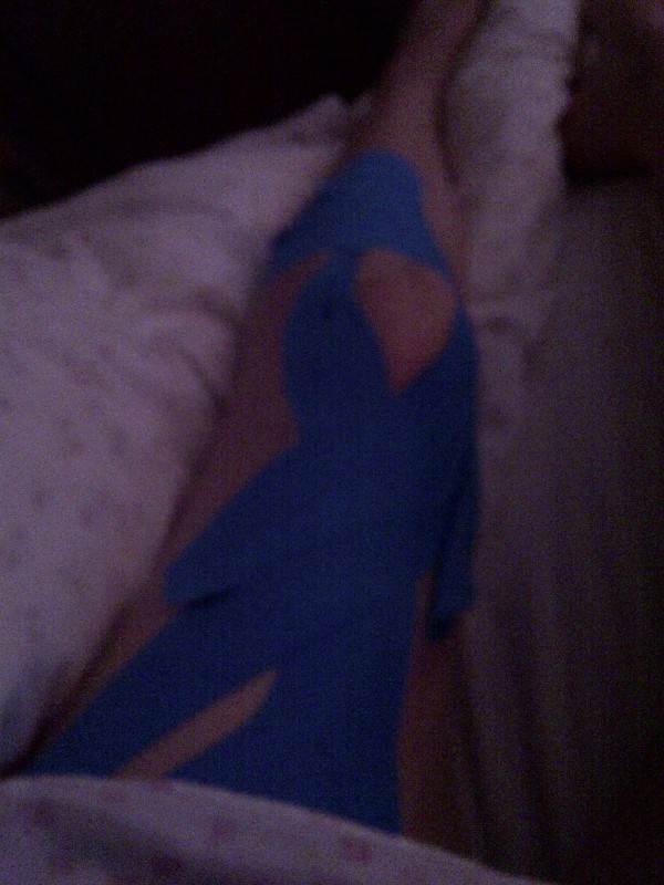 Left knee kinesiology taping - the top edges are starting to come loose 